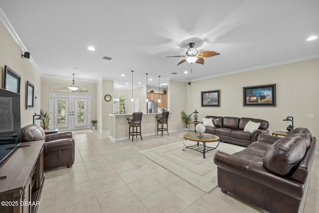 living room featuring baseboards, visible vents, ornamental molding, french doors, and light tile patterned flooring