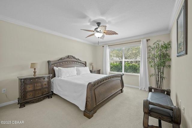 bedroom featuring ornamental molding, light carpet, baseboards, and a ceiling fan