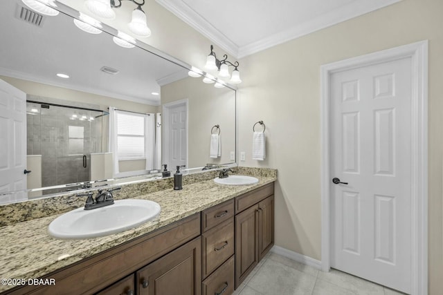 bathroom featuring ornamental molding, a sink, visible vents, and a shower stall