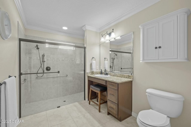 bathroom featuring tiled shower, toilet, ornamental molding, tile patterned flooring, and vanity