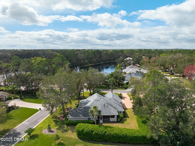 bird's eye view featuring a water view and a forest view