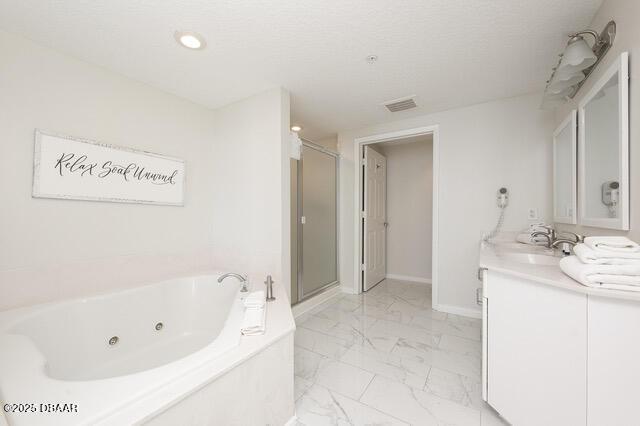 bathroom featuring a stall shower, visible vents, a whirlpool tub, marble finish floor, and vanity