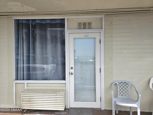 1233 S Atlantic Ave Unit 1030, Daytona Beach, FL 32118 - view of exterior entry featuring concrete block siding