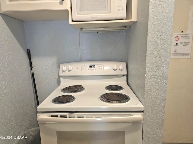 kitchen featuring white electric stove