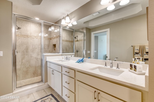 bathroom with vanity, tile patterned floors, and an enclosed shower