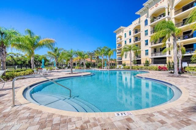 view of swimming pool featuring a patio area