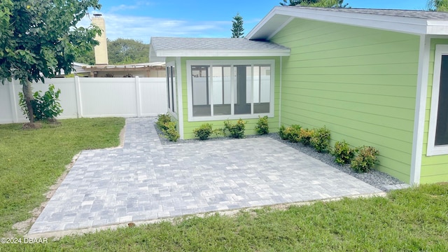 exterior space featuring a patio and a yard