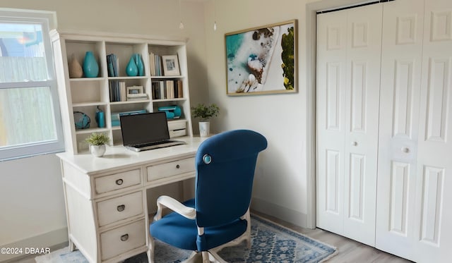 office with light hardwood / wood-style flooring