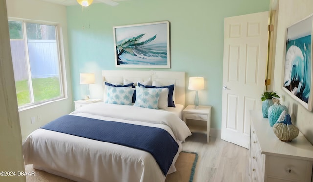 bedroom featuring light hardwood / wood-style flooring and ceiling fan