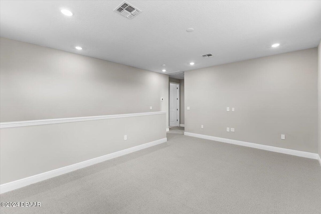 spare room with light colored carpet