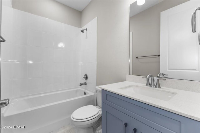 full bathroom with toilet, tiled shower / bath combo, and vanity