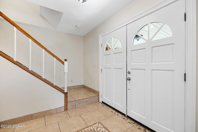 entryway featuring a healthy amount of sunlight and light tile patterned floors