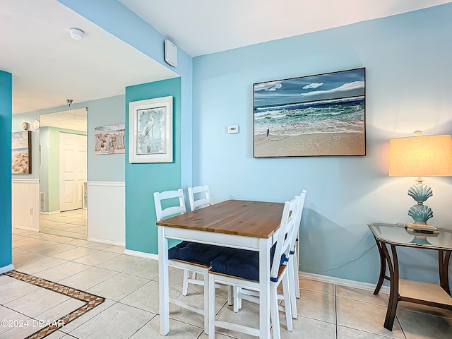 dining area with light tile patterned floors