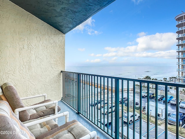 balcony featuring a water view