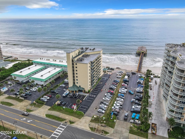 bird's eye view with a water view and a beach view