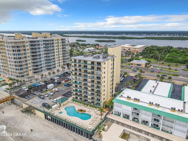 birds eye view of property with a water view