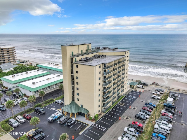 drone / aerial view with a view of the beach and a water view