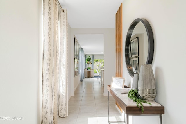 hall with light tile patterned floors