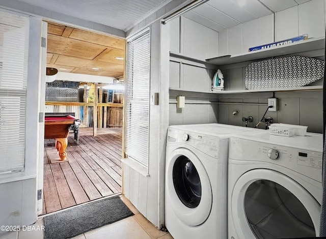 54 Tropical Dr, Ormond Beach, FL 32176 - washroom featuring washer and clothes dryer, billiards, and light wood-style floors