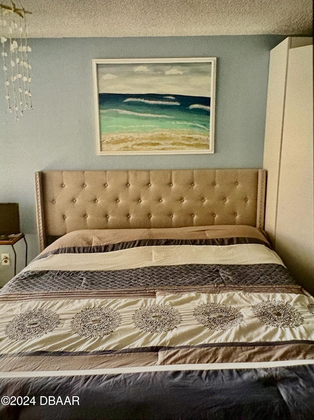 bedroom featuring a textured ceiling