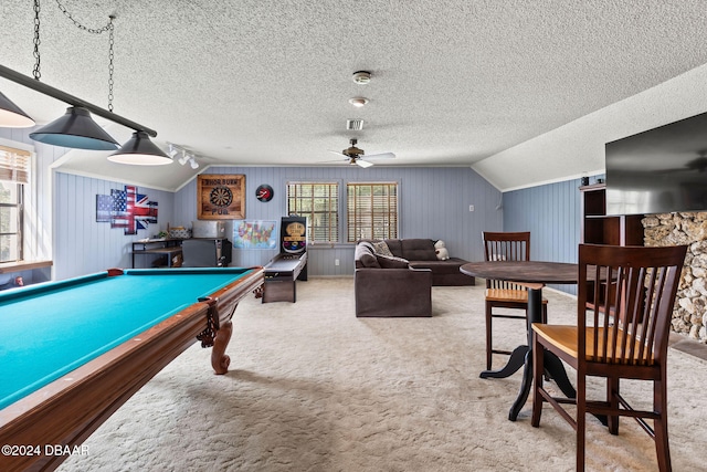 rec room featuring wood walls, pool table, a textured ceiling, carpet flooring, and lofted ceiling