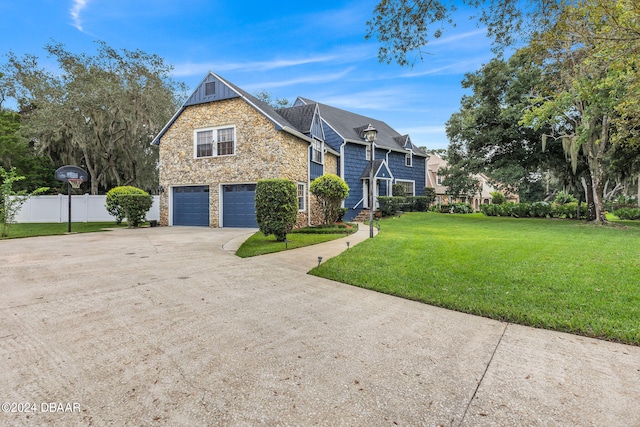 view of front facade with a front lawn and a garage