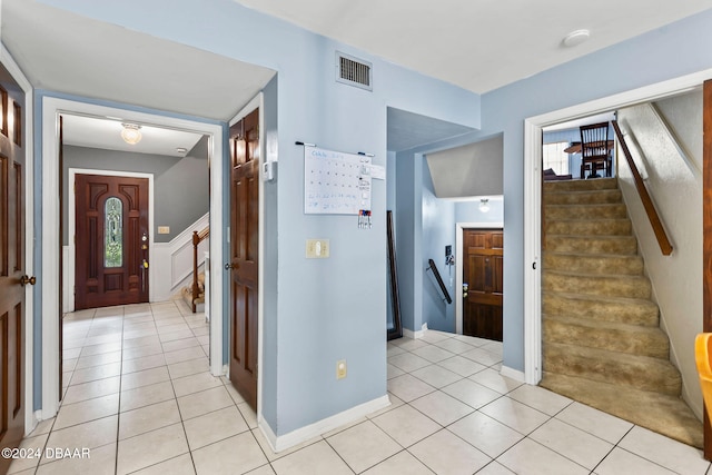 interior space featuring plenty of natural light and light tile patterned floors