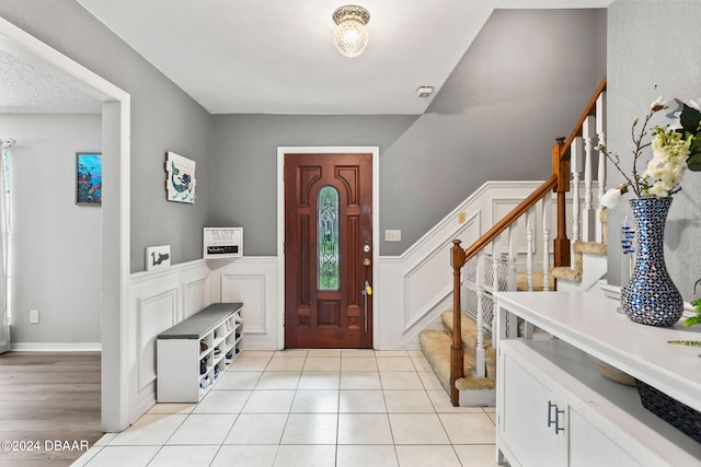 entrance foyer with light tile patterned floors