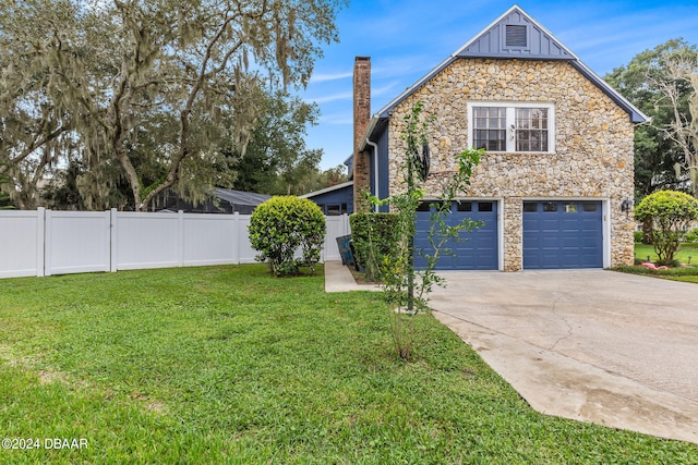 view of property exterior with a garage and a yard