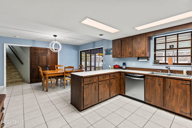 kitchen with stainless steel dishwasher, plenty of natural light, sink, and kitchen peninsula