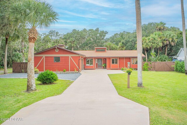 ranch-style house with a front lawn