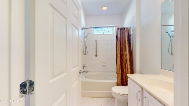 full bathroom featuring tile patterned flooring, vanity, shower / tub combo with curtain, and toilet