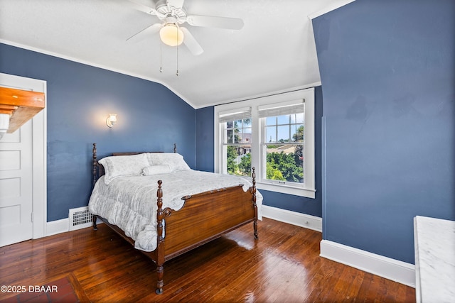 bedroom featuring ceiling fan, dark hardwood / wood-style floors, and vaulted ceiling