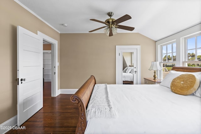 bedroom with ceiling fan, lofted ceiling, crown molding, and dark hardwood / wood-style flooring