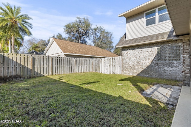 view of yard with a fenced backyard