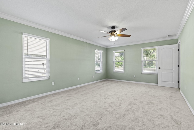 unfurnished room with a healthy amount of sunlight, light carpet, and crown molding