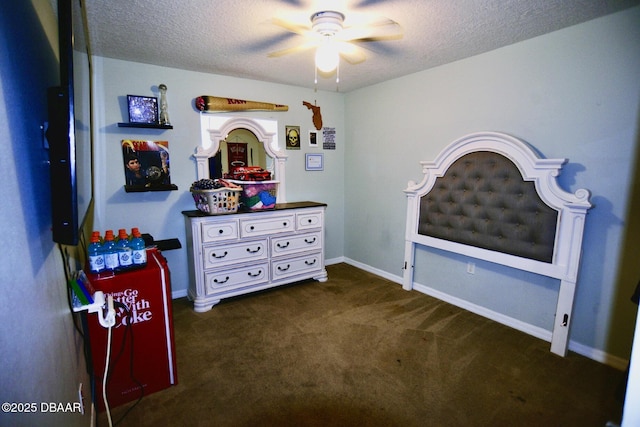 bedroom featuring a textured ceiling, carpet, and baseboards