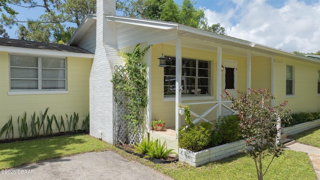 38 Lorillard Pl, Ormond Beach, FL 32174 - view of property exterior with a chimney