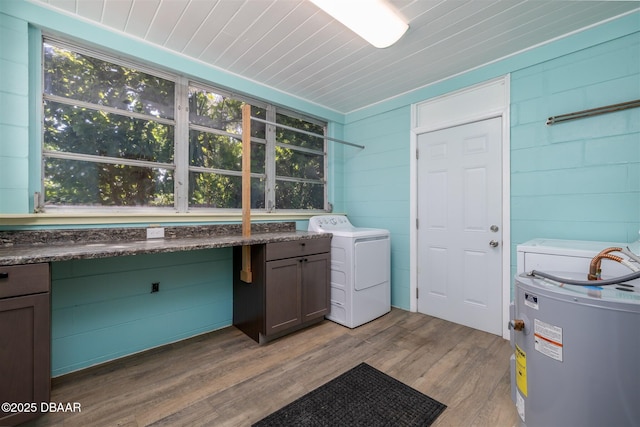 38 Lorillard Pl, Ormond Beach, FL 32174 - laundry room with washer / clothes dryer, cabinet space, light wood-style floors, and electric water heater