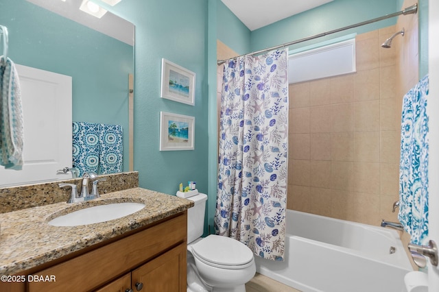 full bathroom featuring vanity, shower / bath combination with curtain, and toilet