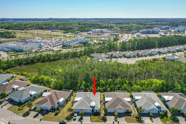 birds eye view of property with a residential view