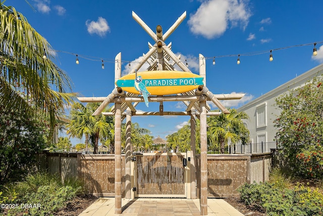 exterior space featuring fence and a gate