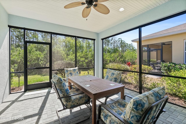 sunroom with a ceiling fan