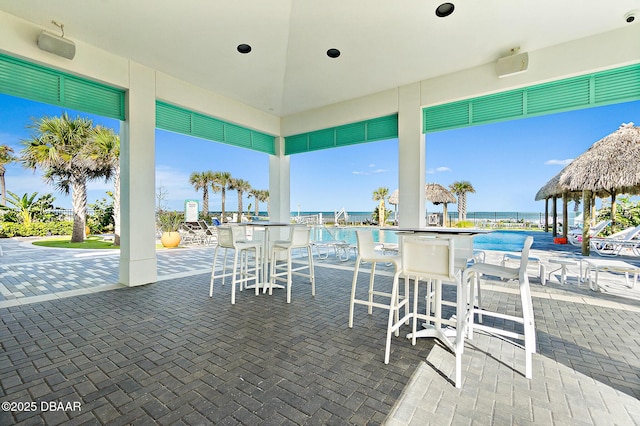 view of patio with a water view