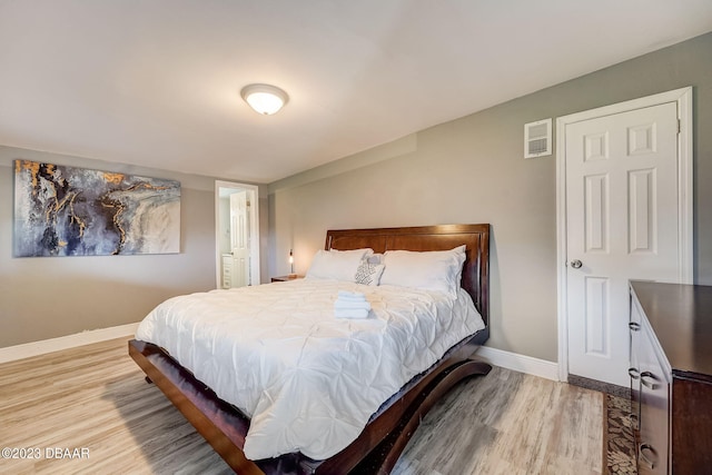 bedroom with light hardwood / wood-style floors