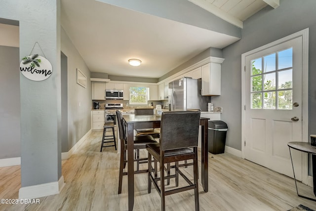 dining space featuring light hardwood / wood-style flooring