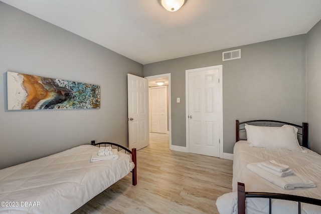 bedroom with light hardwood / wood-style flooring