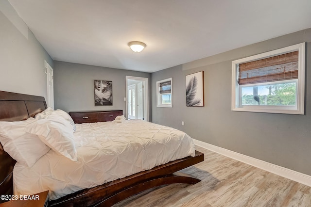 bedroom with hardwood / wood-style floors