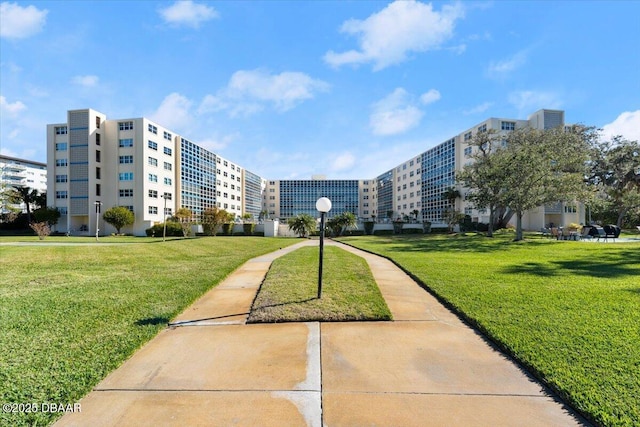 view of home's community with a lawn