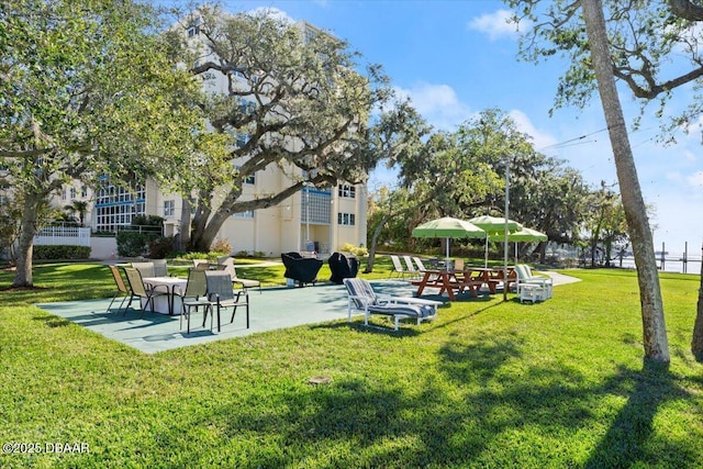 view of home's community with a yard